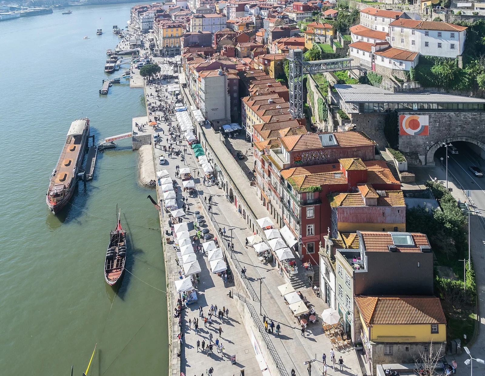 Ribeira riverside and tiled rooftops seen from the upper deck of Dom Luis I Bridge.
